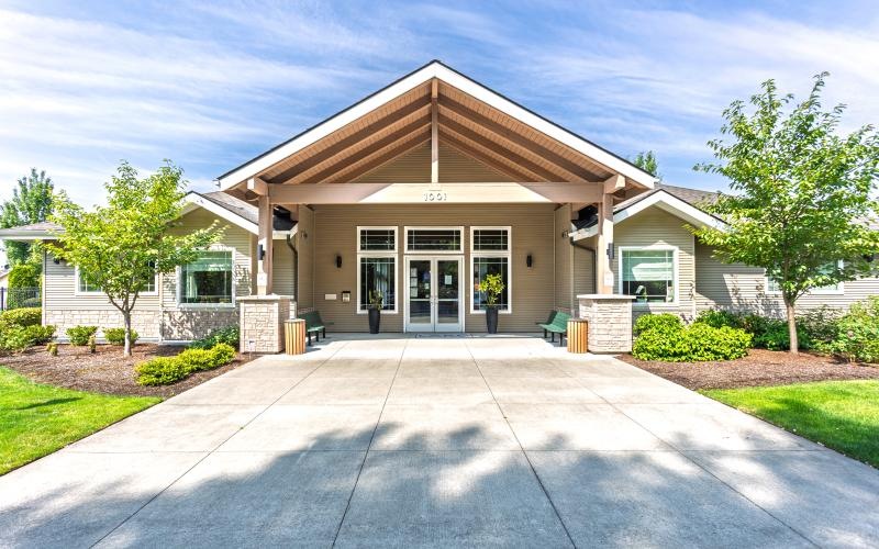 an entrance with a large driveway