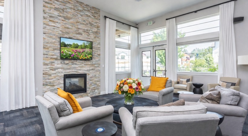 a spacious room with lounge chairs